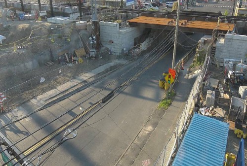 View of East Ave under the railroad bridge with new bridge steel
