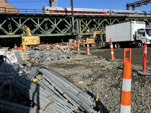 Metro-North Passenger train crosses Norwalk Railroad Bridge as construction continues underneath